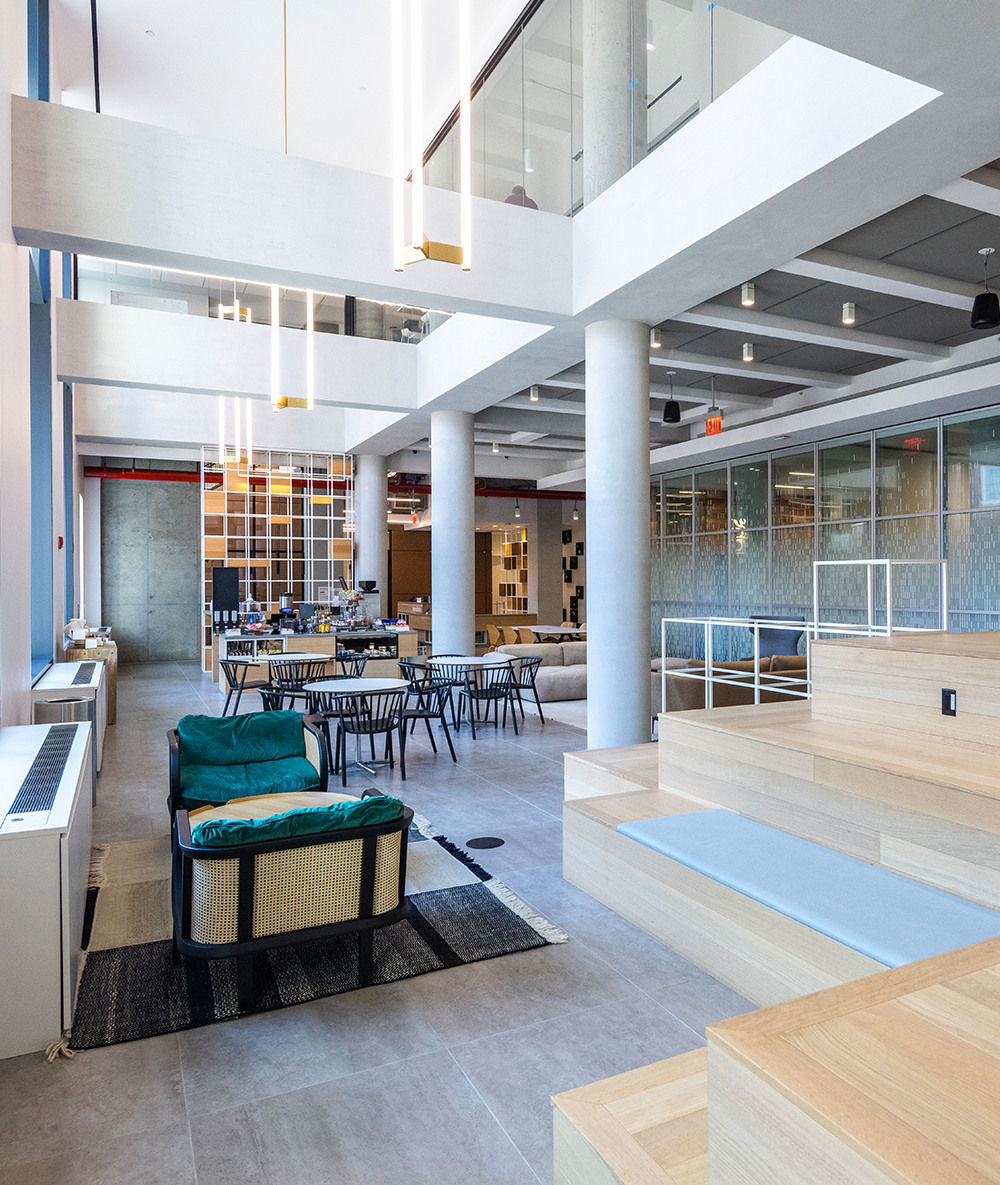 A barista serves a tenant coffee at Innolabs' ground floor coffee shop