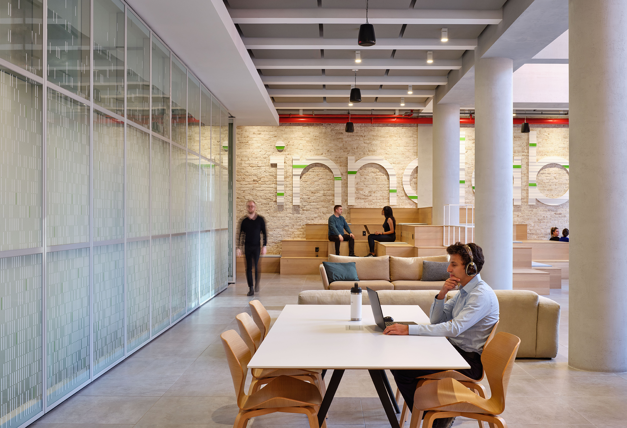 Exterior nighttime sidewalk view of the entrance to Innolabs